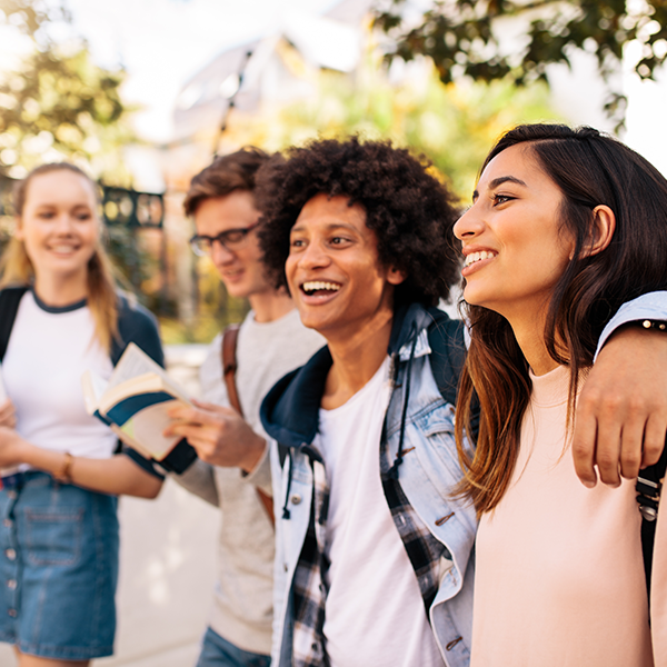 A group of youth spending time together and laughing.